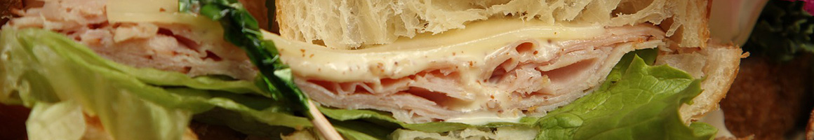 Eating Sandwich Cafe at Cafe Artys restaurant in Newport Beach, CA.